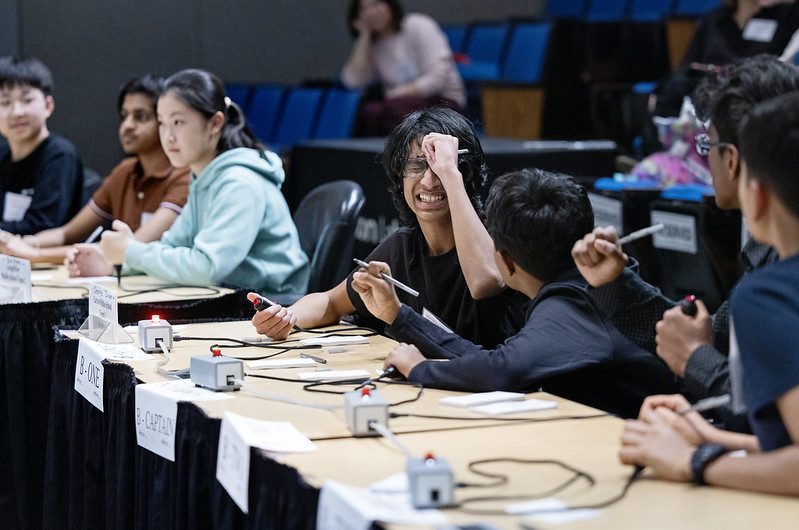 Students at a desk.